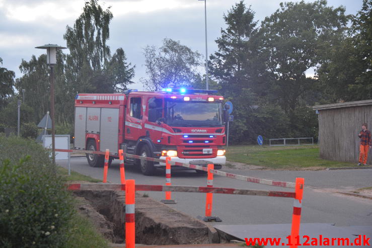 Brand i tøj container.