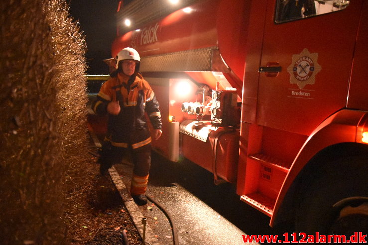 Brand Bil under tag. Storedalsvej i Bredsten. 31/12-2019. Kl. 22:35.